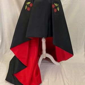 Sherri Hill Black high low with a red lining and embroidered cherry pockets.